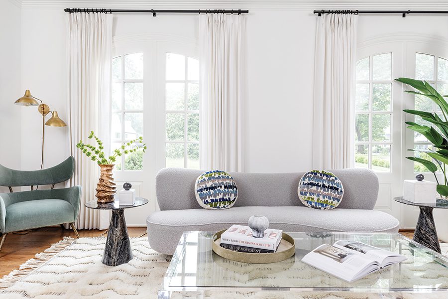 A Foxcroft home with a white living room designed by House of Nomad in Charlotte.