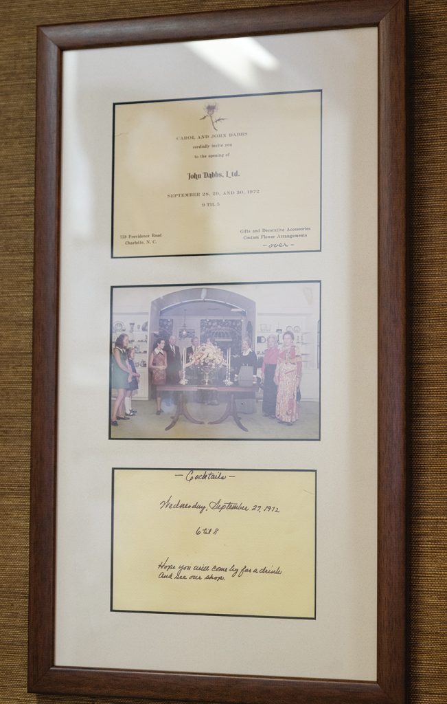 A framed invitation of the grand opening to John Dabbs Ltd. in 1972.