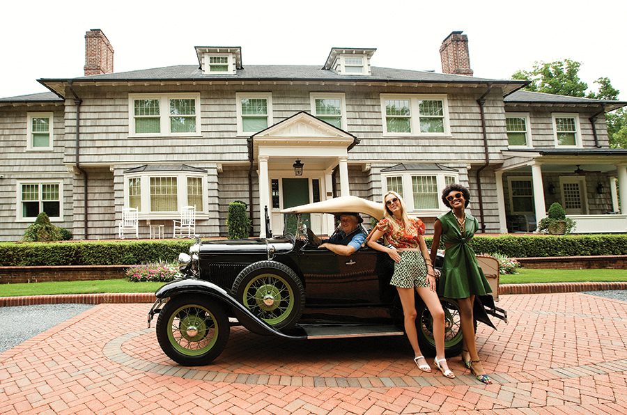 Models Elaine Metcalf and Carmen York, in front of a private home in Pinehurst with Frank Riggs of Carriage Tours of Pinehurst Village. Frank is in his 1931 Ford Model A Deluxe Roadster.