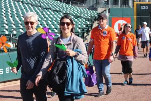 Participants in the Alzheimer's Walk in uptown Charlotte at Truist Field.