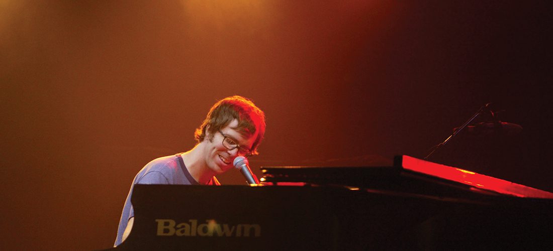 Musician, Ben Folds, playing the piano.