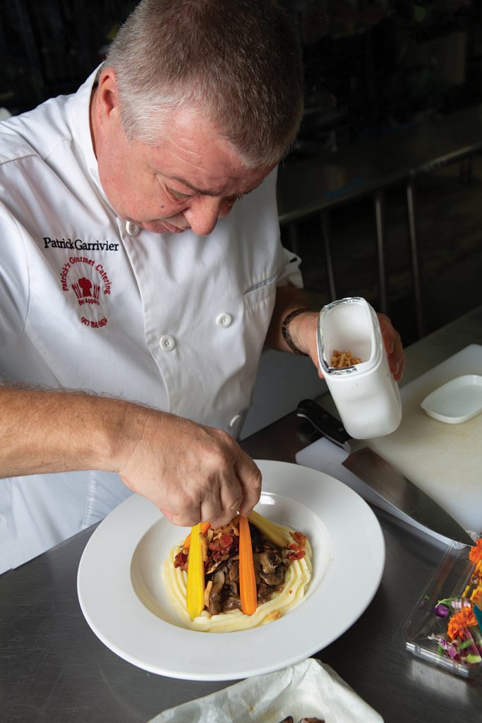 Charlotte chef Patrick Garrivier prepares a dish for his catering business, Patrick's Gourmet.