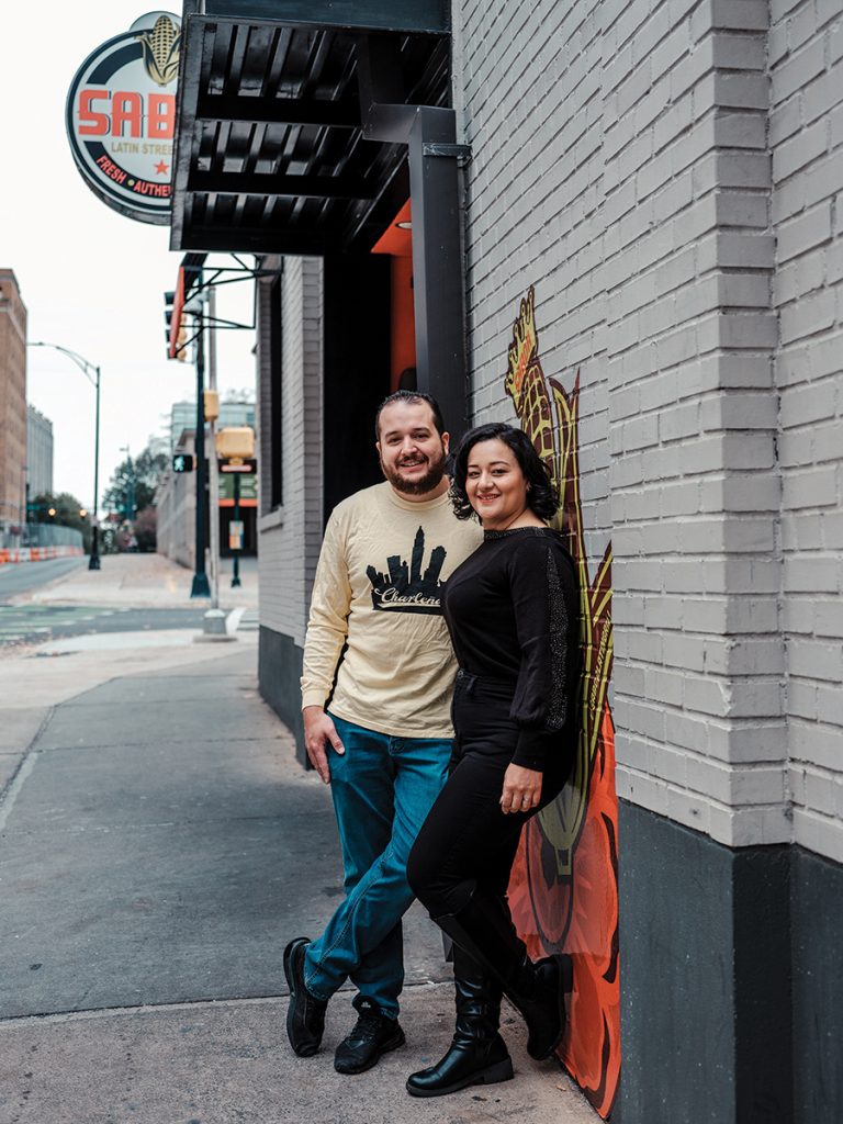 Miriam and Dalton Espaillat standing outside of Sabor Latin Street Grill.