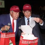Felix Sebates and Pat McCrory look over the script.