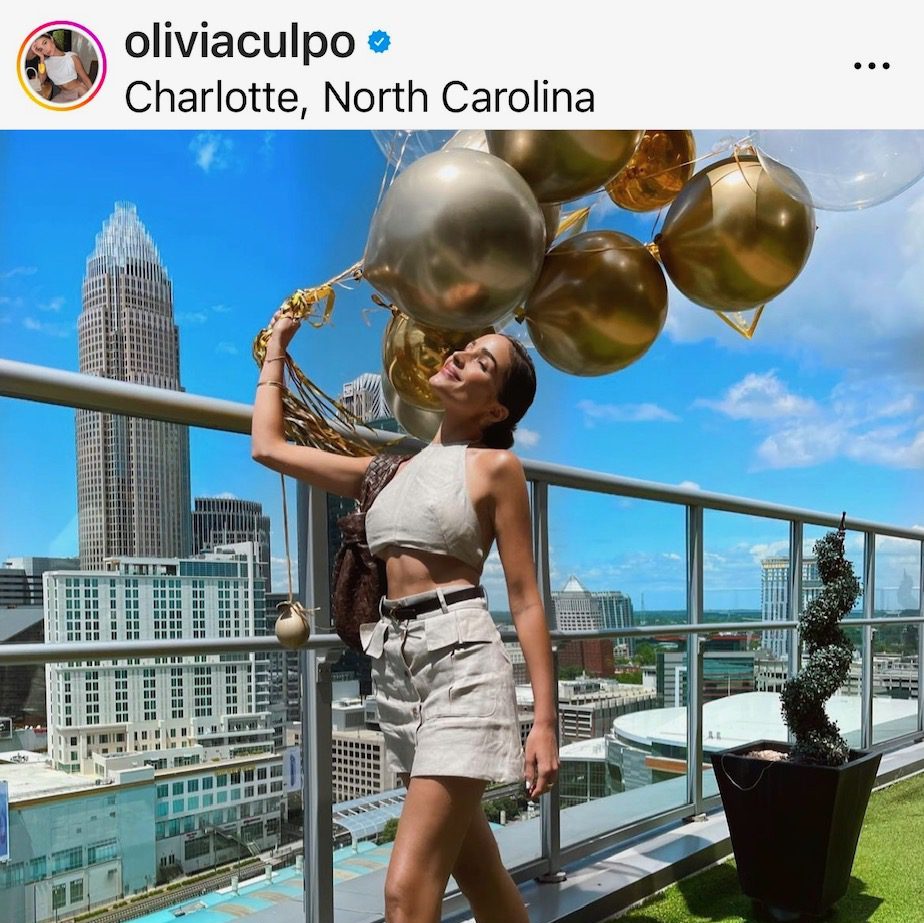 Olivia Culpo's Instagram post from atop Christian McCaffrey's penthouse condo in Charlotte.