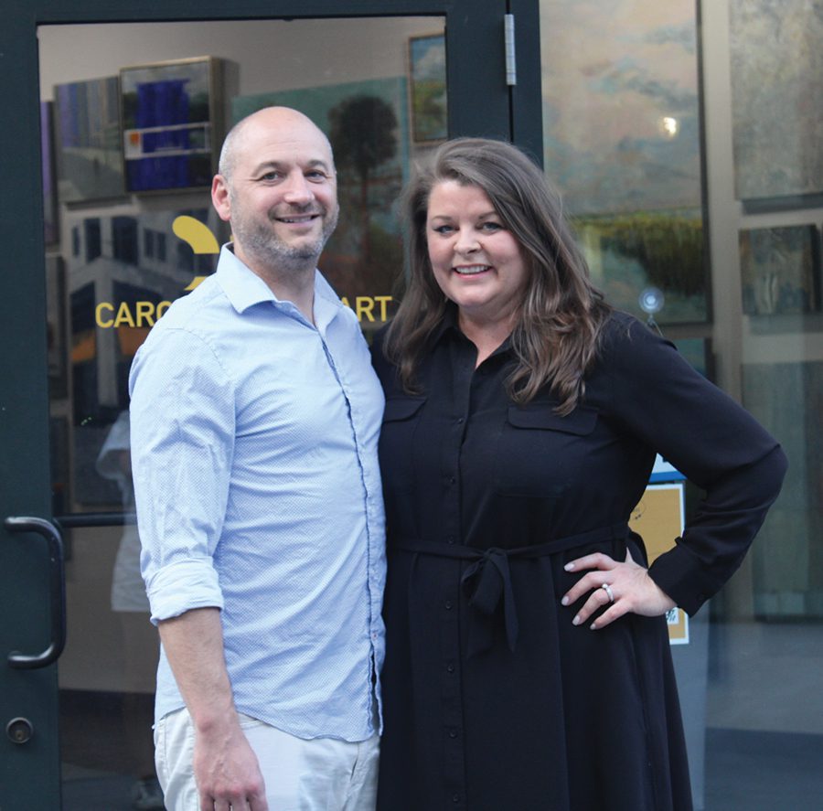 Amy Murphy Curlis and her husband, Shawn, stand outside Carolina Fine Art in Cotswold.