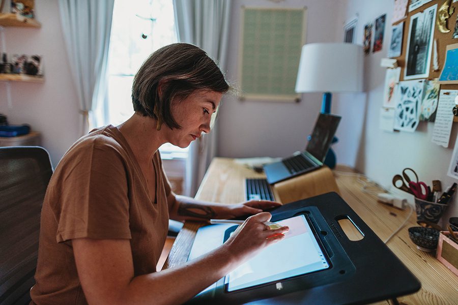 Children's book illustrator Jesse White works on a project at her home in Durham, N.C.