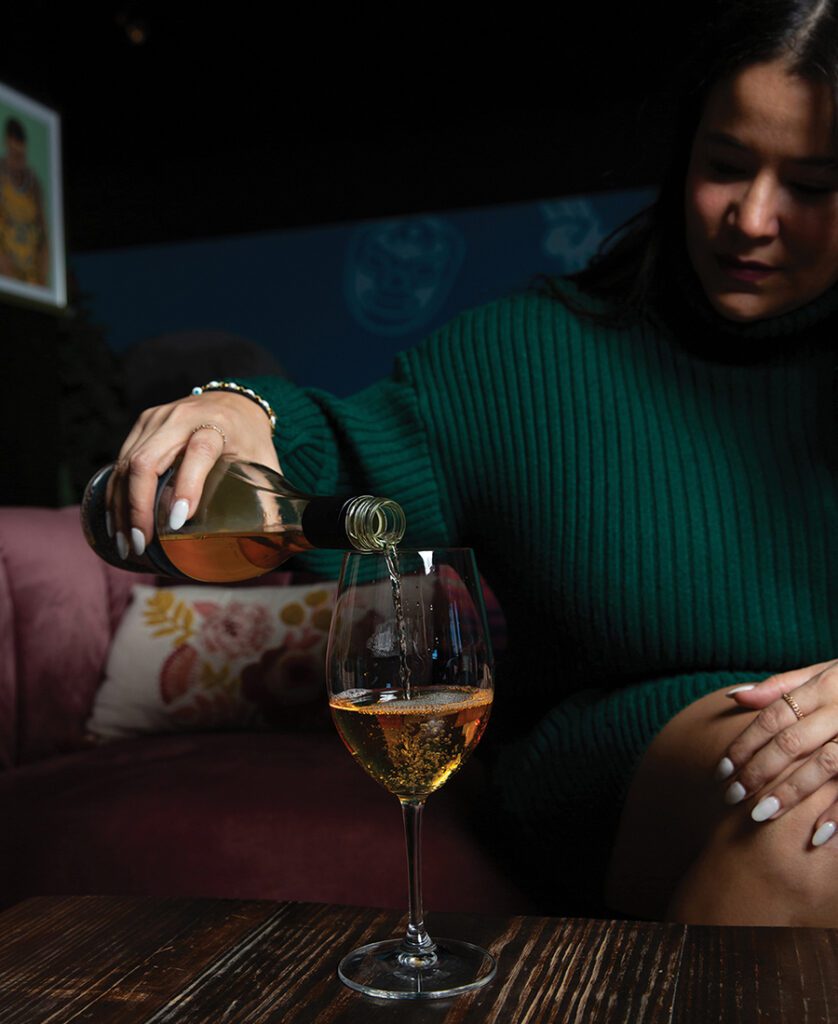 A glass of wine being poured at Salud Cerveceria in Charlotte, N.C.