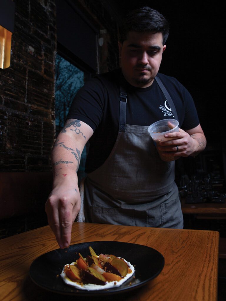 Chef-owner Andres Kaifer puts the finishing touch on Customshop’s beet appetizer