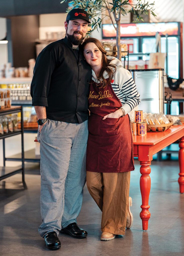 Raffaele and Madison Patrizi stand together inside their new cafe and market in SouthPark, Mano Bella Artisan Foods.