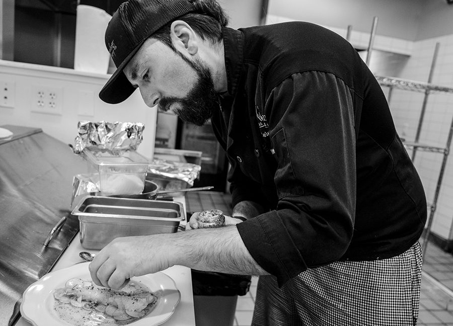 Raffaele Patrizi work a dough inside his market-cafe, Mano Bella in SouthPark.