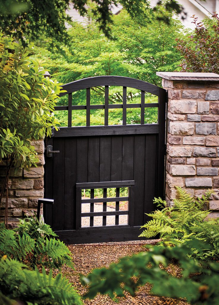 Blair garden gate with cutouts low to the ground for the couple’s three dogs to peer through