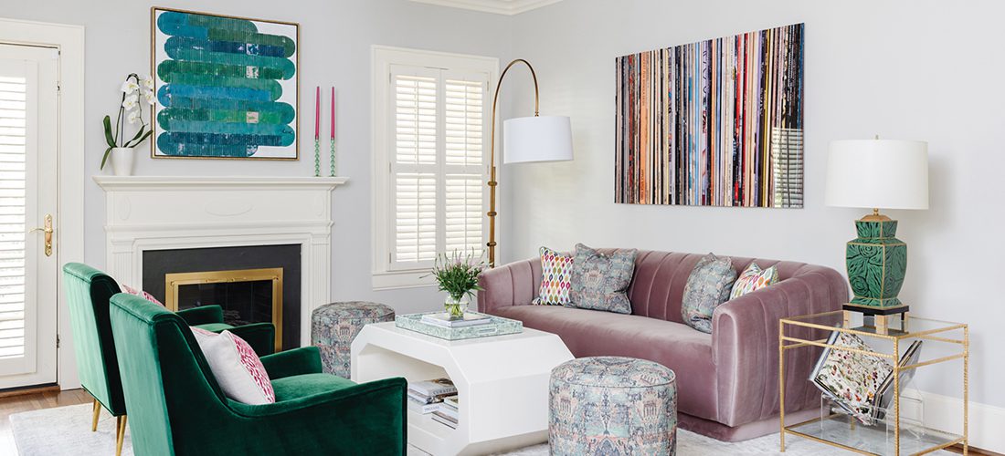 In the living room of this Myers Park home, a photograph of album covers by artist Allyson Monson hangs above the sofa.