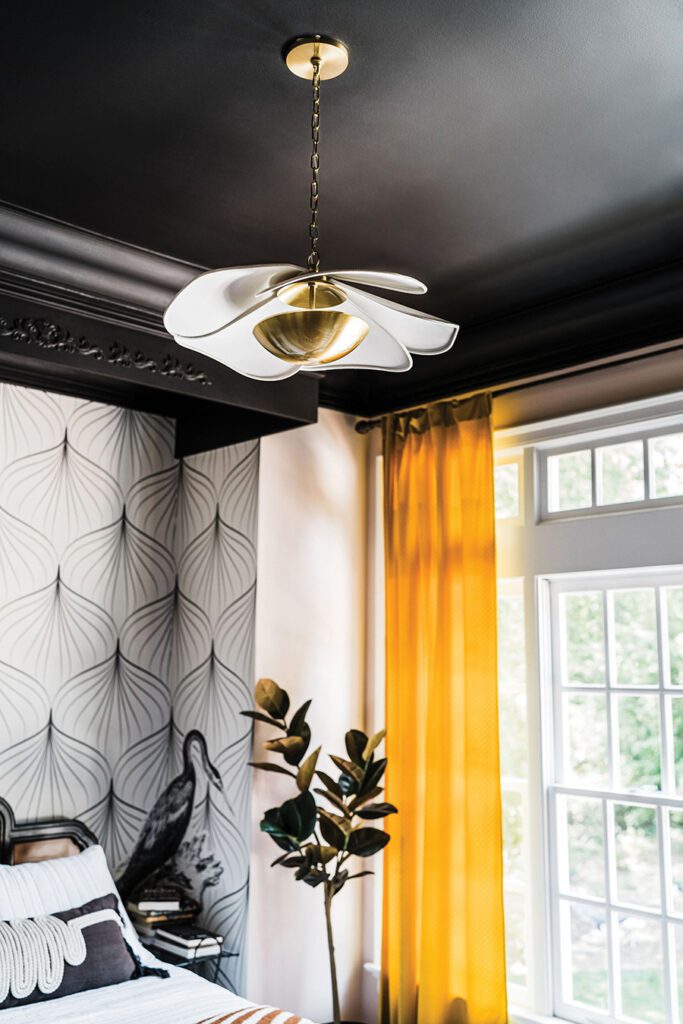 The petal-shaped Madeline pendant from Mitzi lighting has aged brass with off-white linen shades 