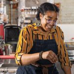 Courtney Evans cooks a dish of mussels.