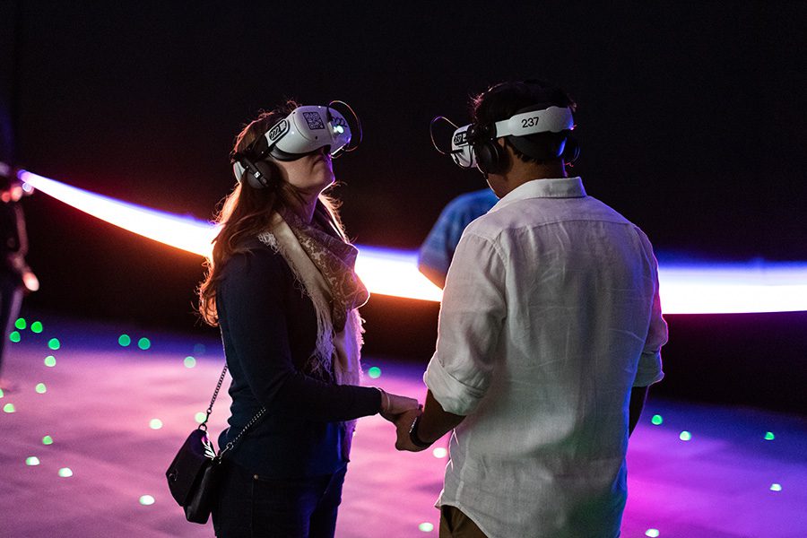 Participants wear virtual reality goggles in the SPACE EXPLORERS: THE INFINTE, an immersive exhibit coming to Charlotte's Iron District from Blumenthal Arts.