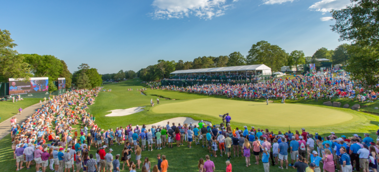 A crowd gathers around a golfer during the Wells Fargo Championship in Charlotte.