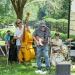 A band plays during Party in the Park at Mint Museum Randolph in Charlotte.