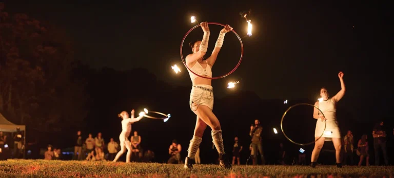Women dancing with fire rings at BrightFire Festival