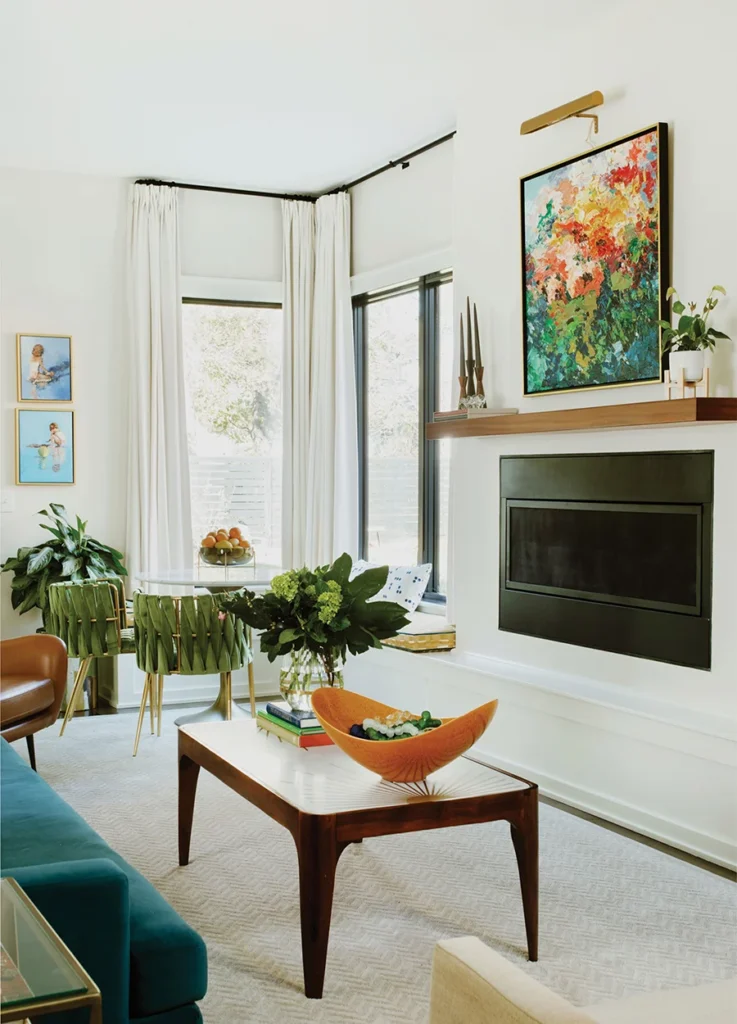 House of Drennan living room, fireplace, breakfast nook, windows, flower art