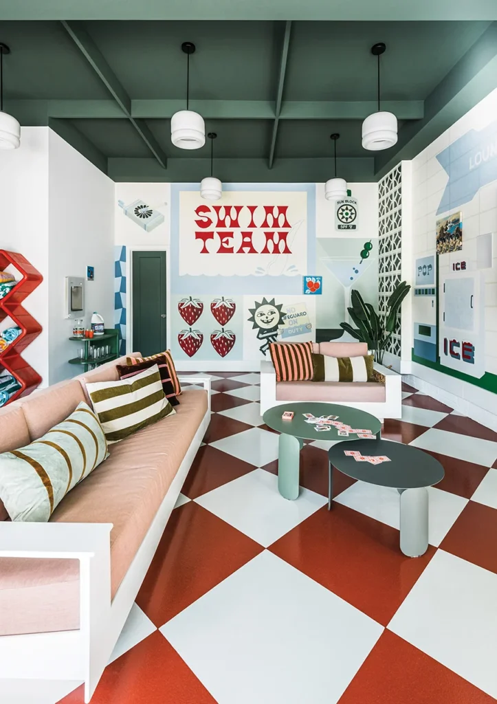 Pool house lounge area with colorful mural