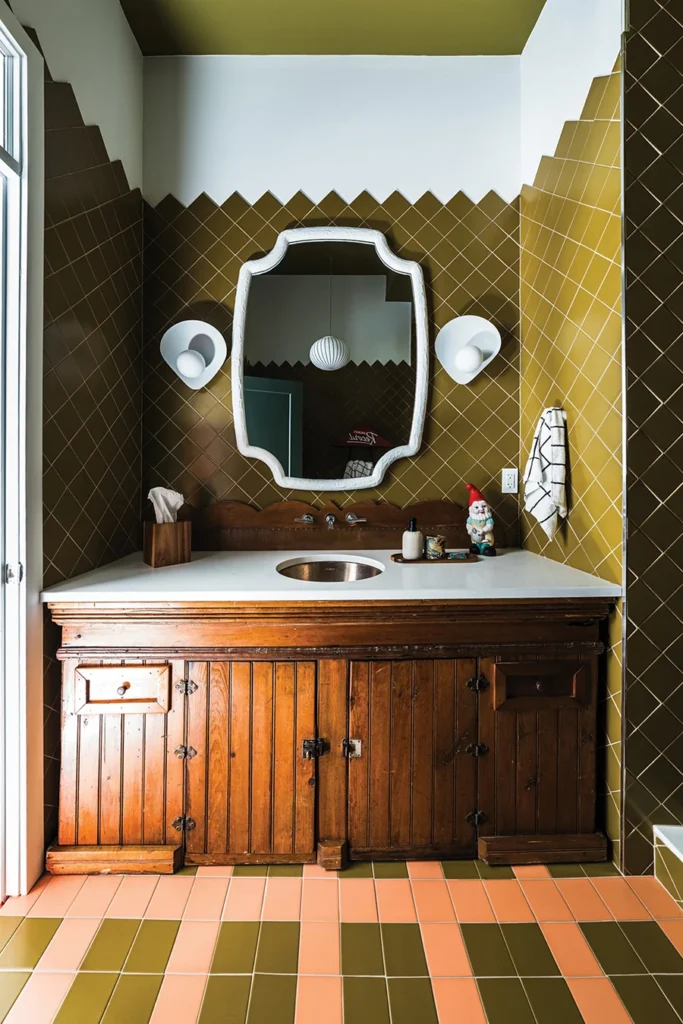 Pool house bathroom with antique cabinet and green tile