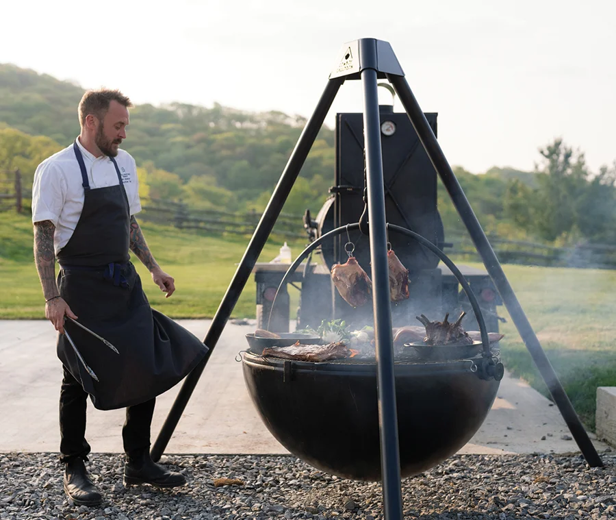 Cataloochee Ranch man grilling meat