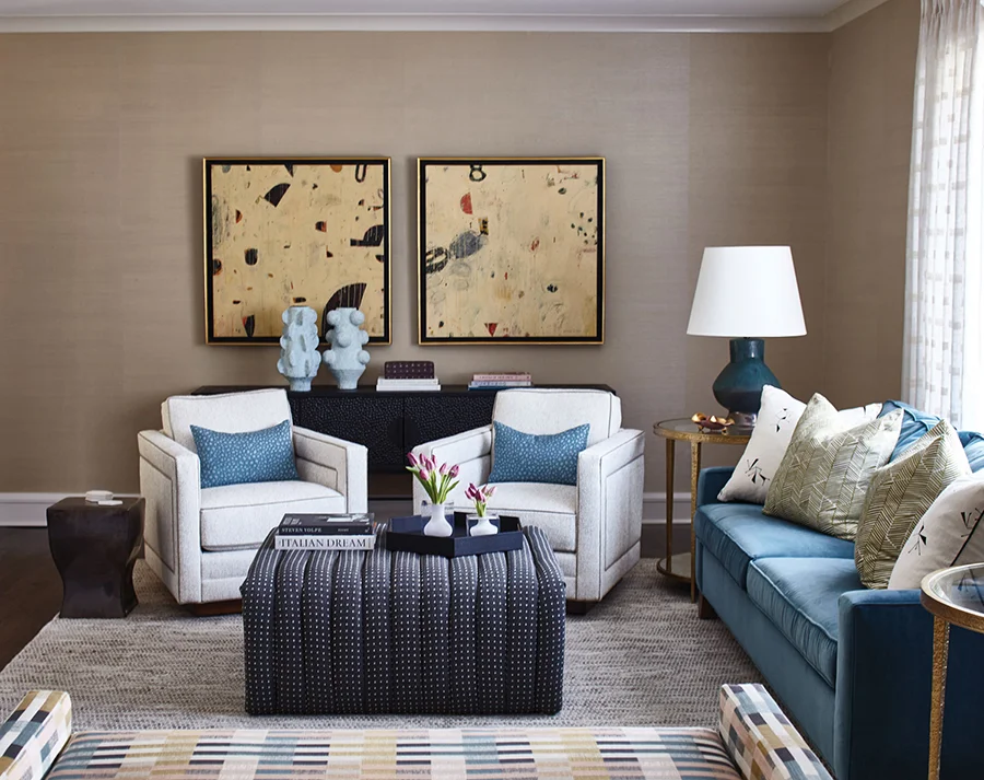 Abstract paintings by Kevin Tolman set a stylish tone in the living room. Home in Carmel Estates neighborhood, designed by Erin Dougherty.
