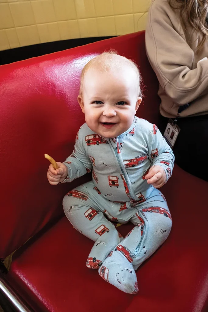 Baby in a booth at Tony's Ice Cream