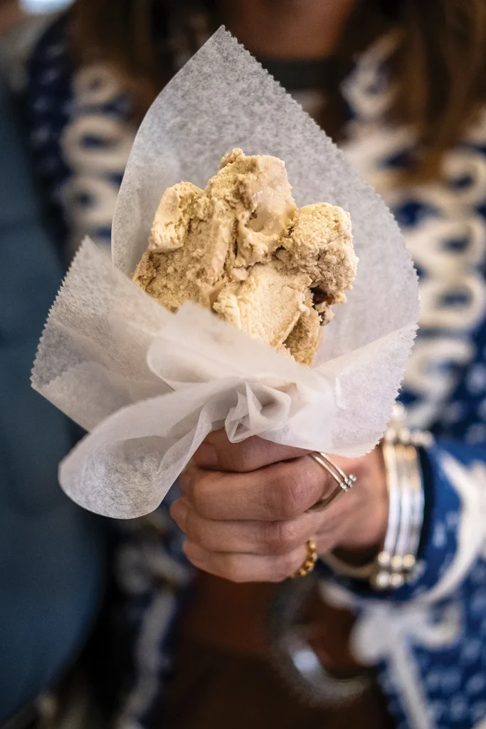 Woman holding Tony's Ice Cream cone