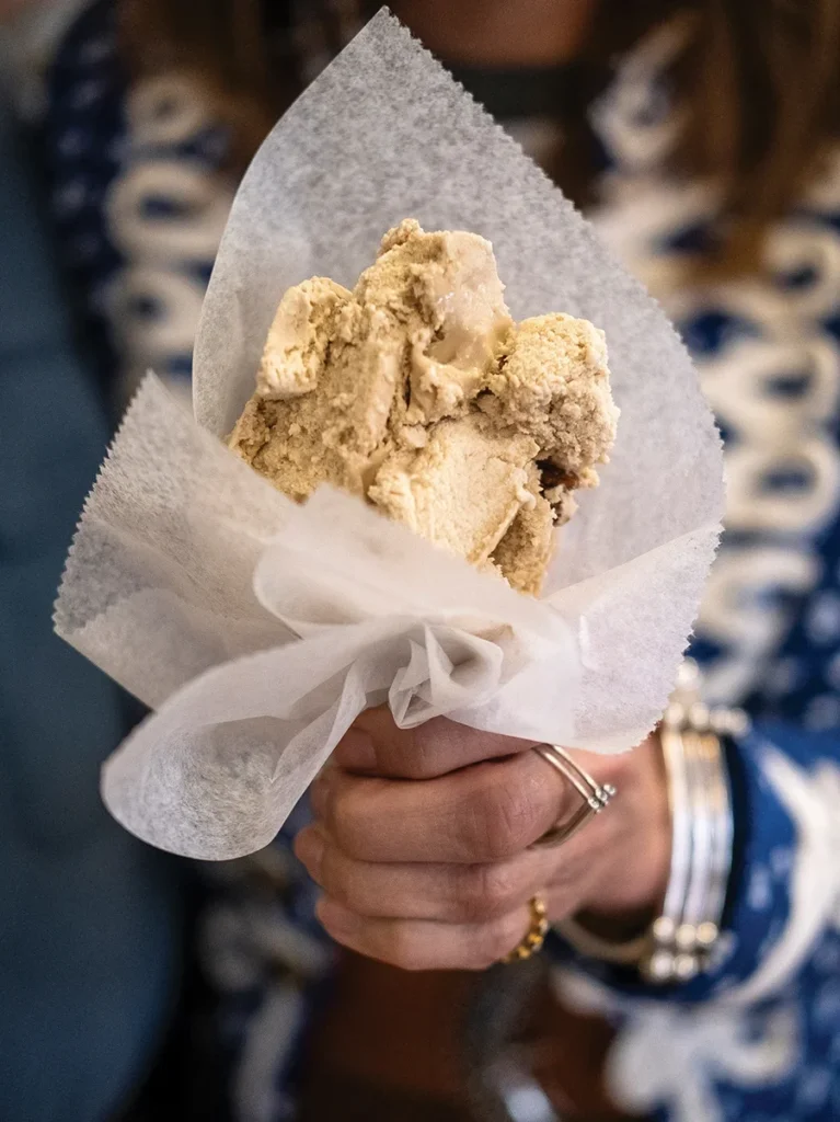 Woman holding Tony's Ice Cream cone