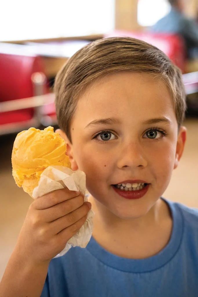 Boy holding a Tony's Ice Cream cone