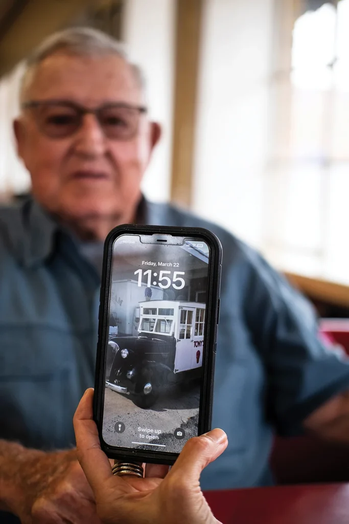 Tony's Ice Cream owner Louis Coletta with photo of his father's vintage ice cream truck