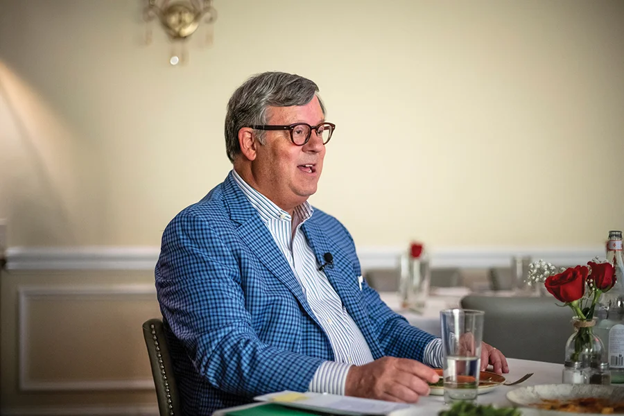 Chris Thomas sitting at a table