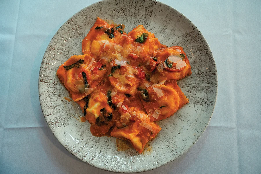 Ricotta-filled ravioli with tomato basil sauce and parmigiano