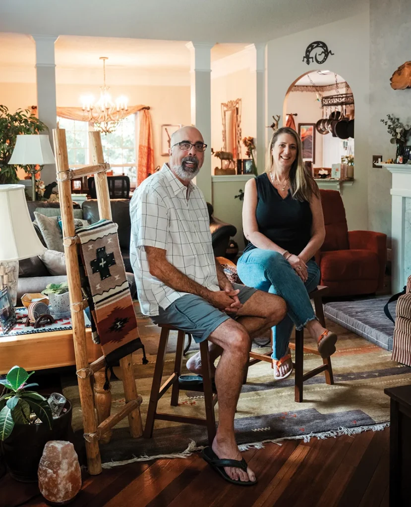Jay and Karen Ahuja at home with their collection of art