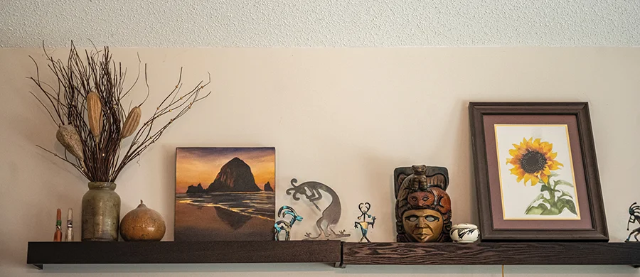 A shelf with art in Jay and Karen Ahuja's home