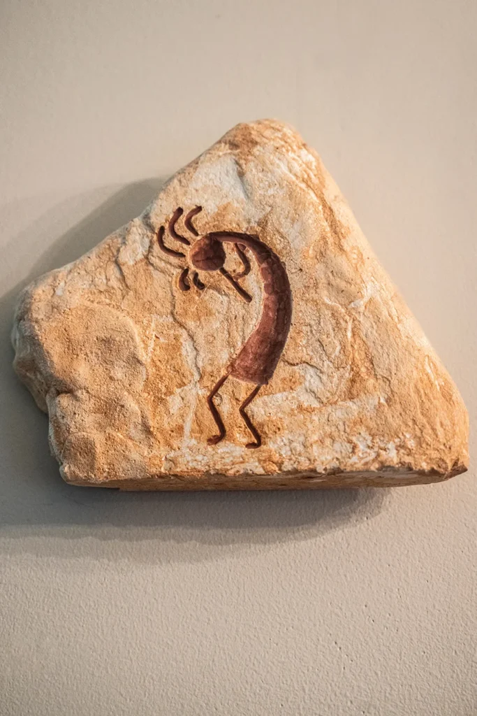 A rock with Kokopelli carving