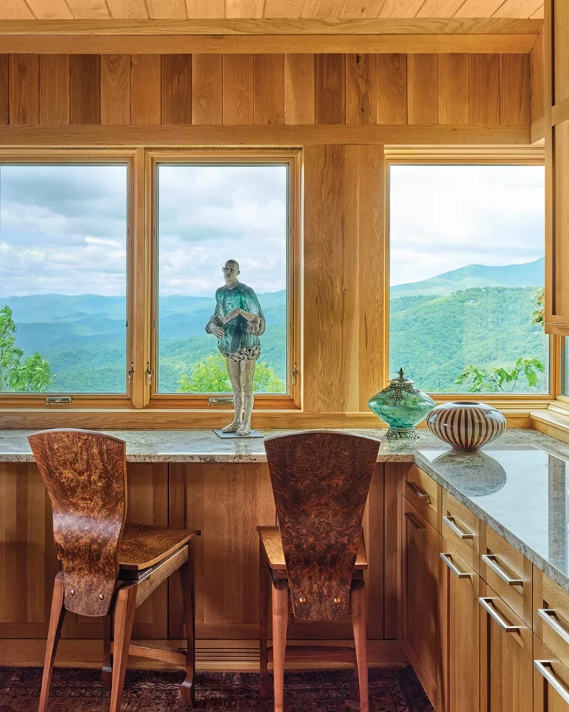 A ceramic and glass figure is a collaboration between Cristina Cordova, a Penland artist known for her figurative sculptures, and glass artist Pablo Soto. The counter stools are made of walnut burlwood by Kentucky wood artist Wyatt Severs.