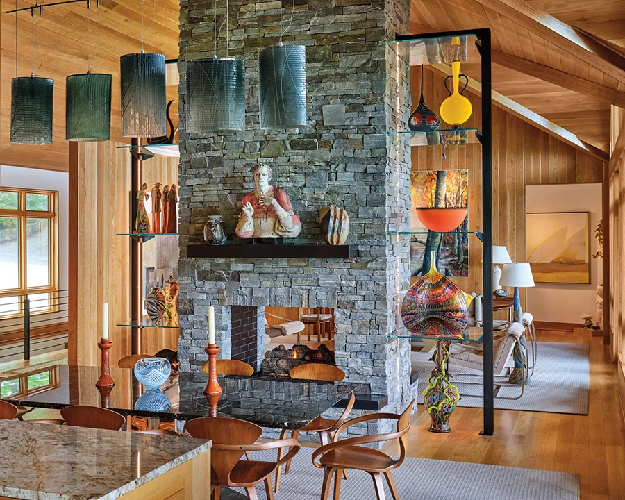 The light fixture over the dining table was designed by glass artist Pablo Soto.