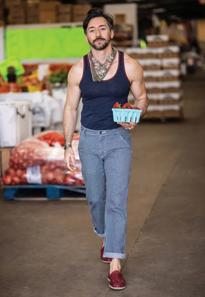 Stephen Warwick holding a basket of strawberries