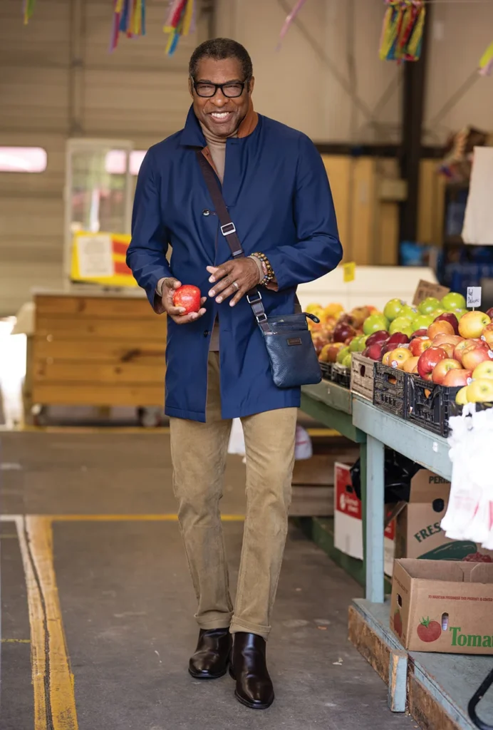 George Hodge holding a red apple