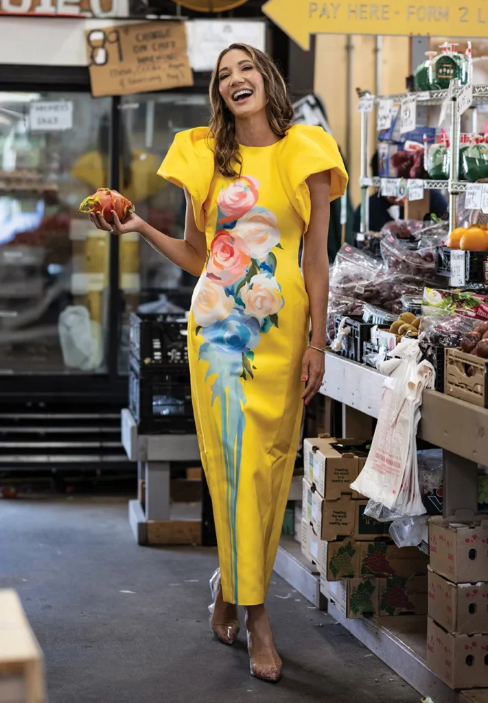 Sarah Edwards Bharti holding a dragonfruit