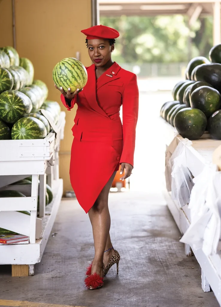 Whitney N. Douglas holding a watermelon