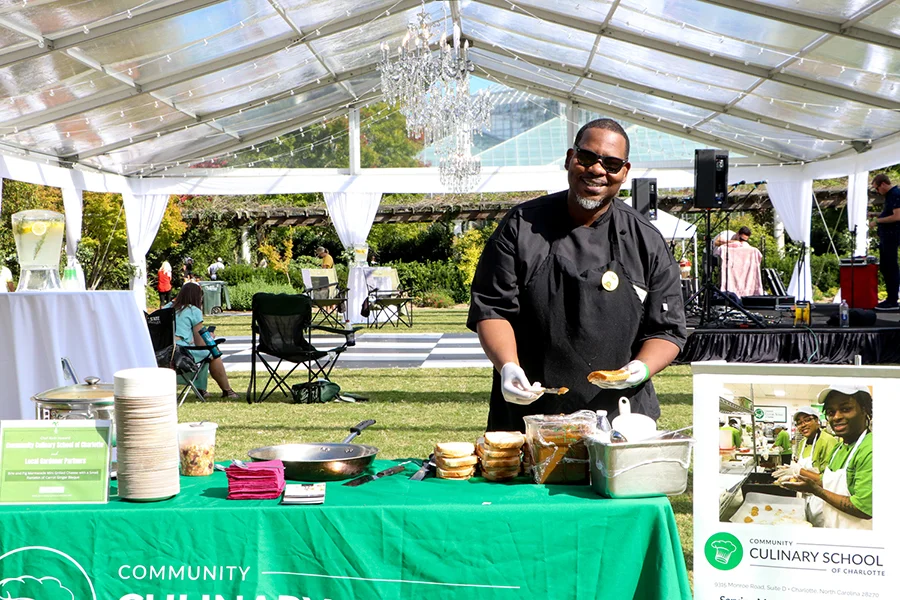 Farm to Fork: In the Garden, man at a table serving food