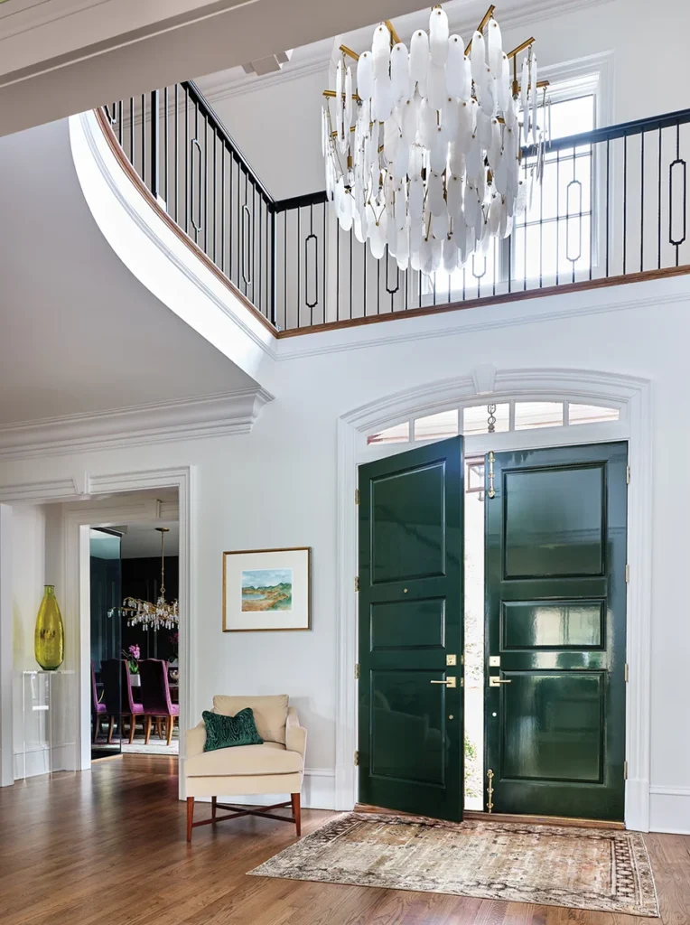 A crystal chandelier by Visual Comfort illuminates the entry hall.
