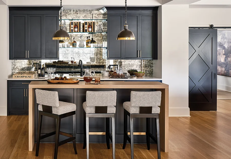 Bonus room bar with barn door entrance of this Traci Zeller styled home