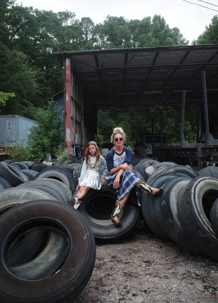 Natalie and Eva sitting on tires