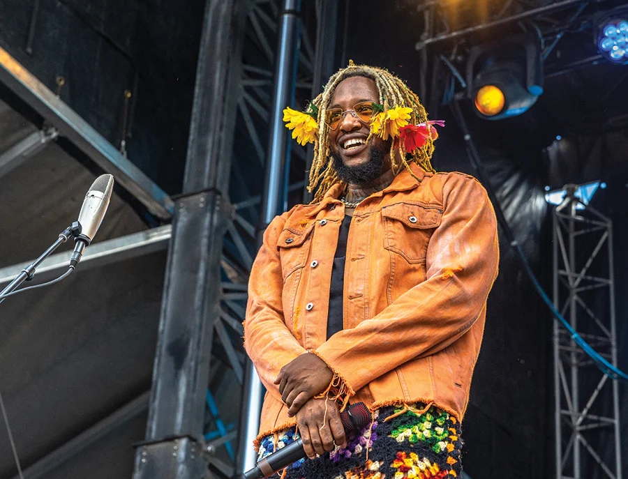 Dennis Read Jr on stage during a music festival in Charlotte.