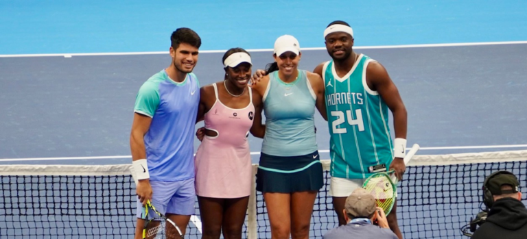 Tennis players Carlos Alcaraz, Sloane Stephens, Madison Keys and Frances Tiafoe pose on the court during the Charlotte Inviational, photo by Ashley Stroehlein